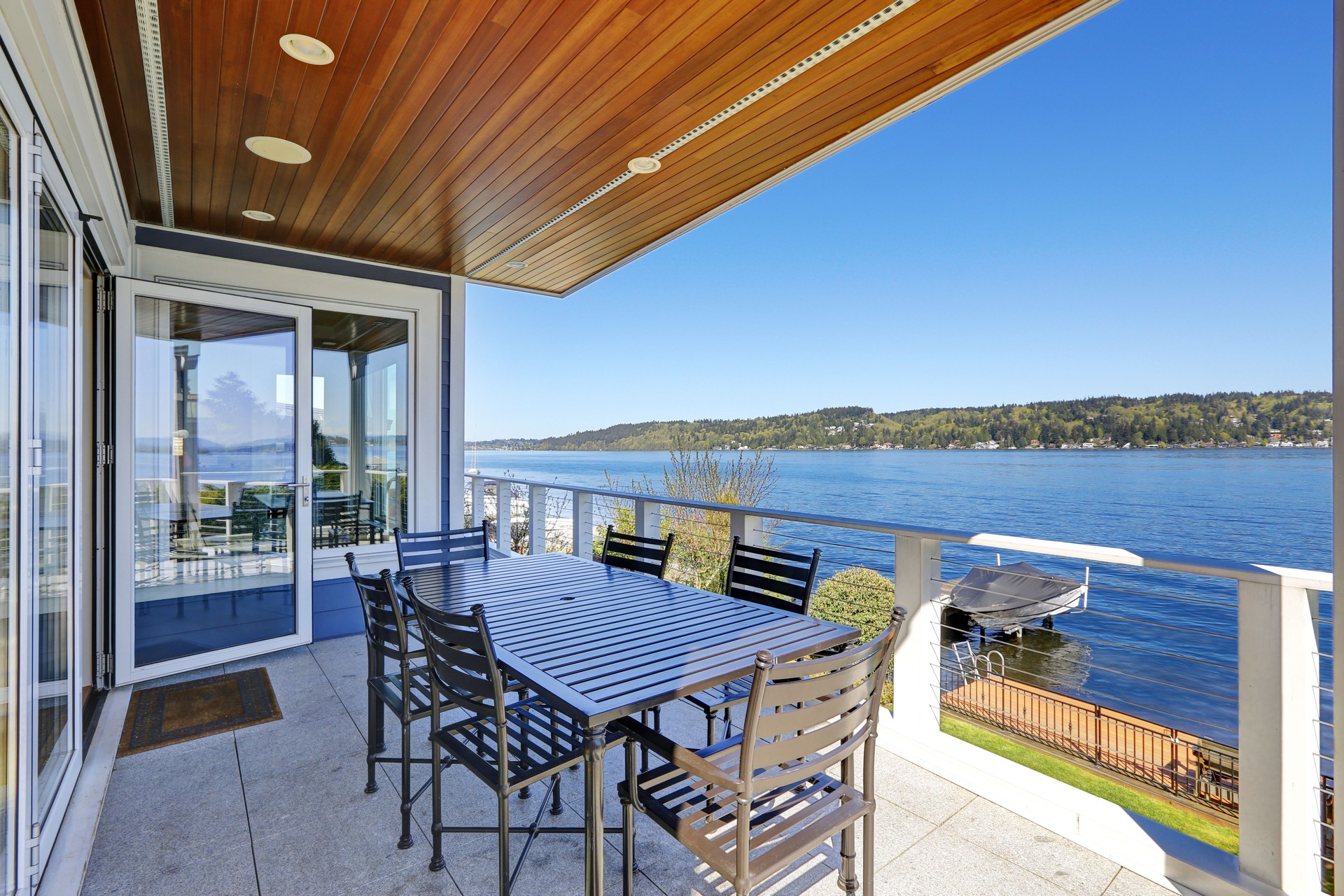 Large covered deck with comfortable outdoor dining space