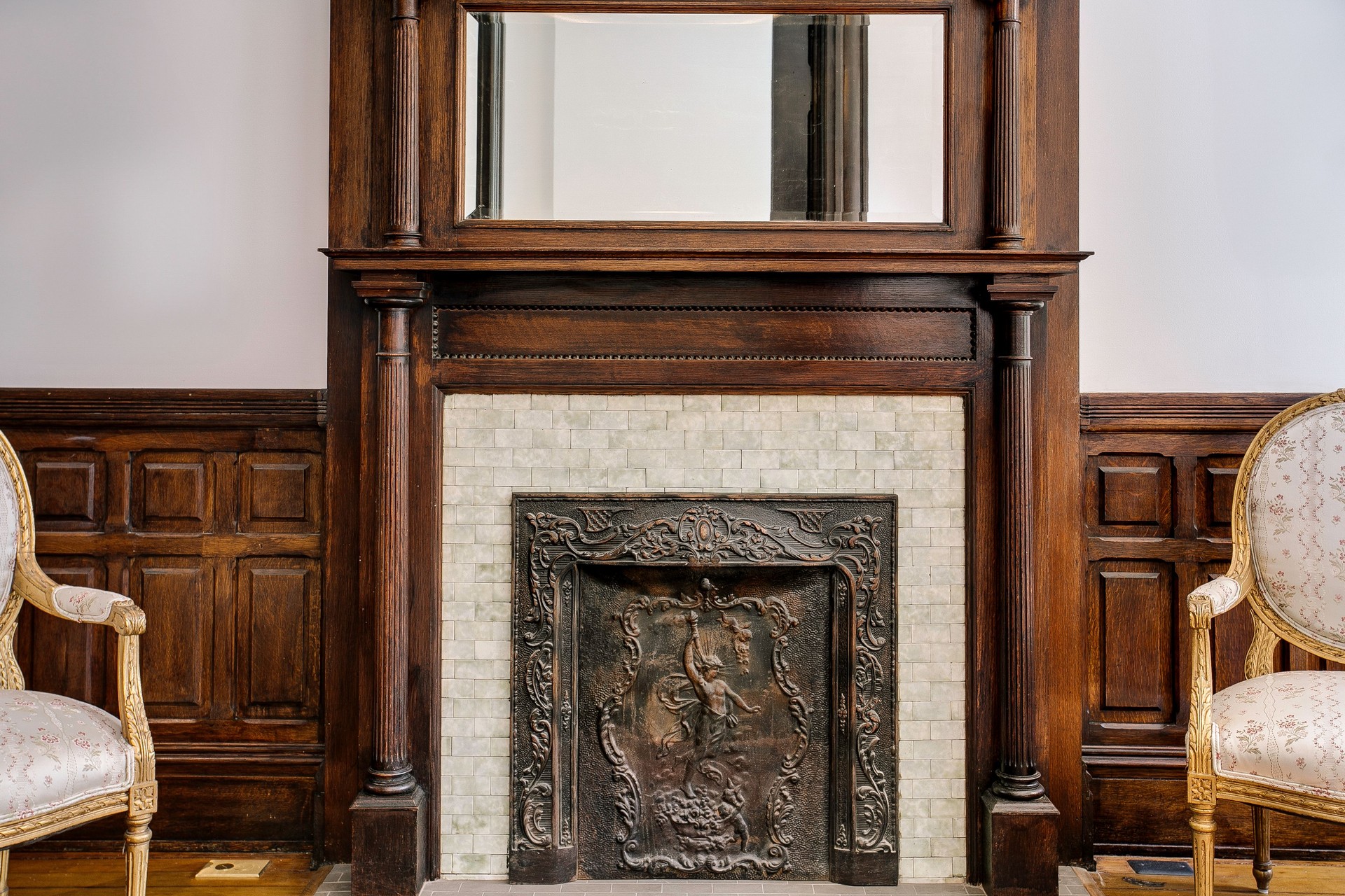 Elegant Vintage Fireplace With Intricate Metalwork.
